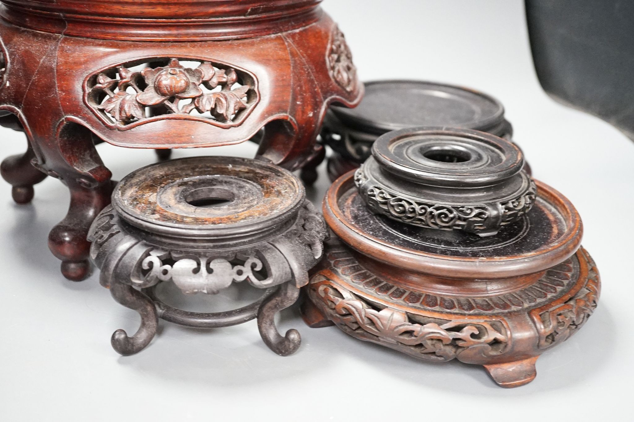 A group of Chinese hardwood stands, 19th/20th century, one marble inset, latter 19cm high